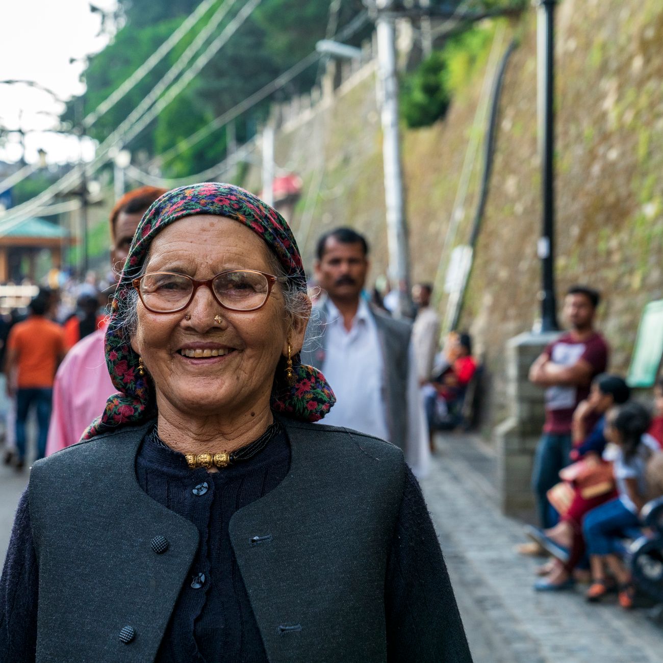 Elderly woman smiling on a street